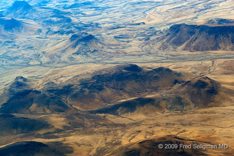 20090603_105559 D3 X1.jpg - We fly over mountains of richly colored volcanic rock